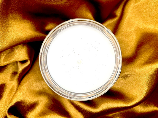 Top-down view of Dragon Rider candle showing white wax with dark speckles