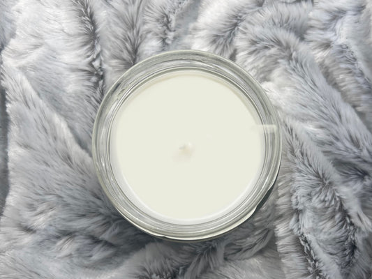 Top-down view of Noah Kahan Stick Season candle's white wax surface