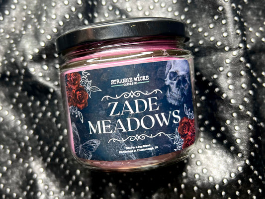 Close-up of Zade Meadows candle label with skull, red roses and butterfly art