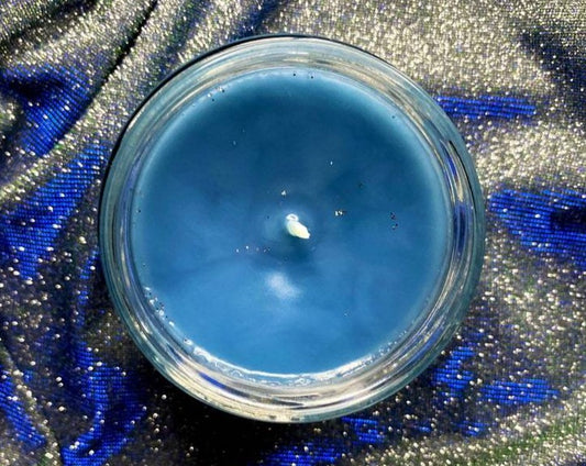 Top-down view of Feyre candle's open jar showing blue wax and wick