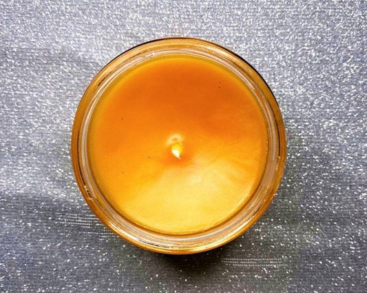 Top-down view of Lucien candle's orange wax