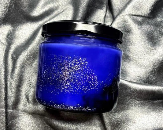Rhysand candle jar with glittering blue wax, label not shown