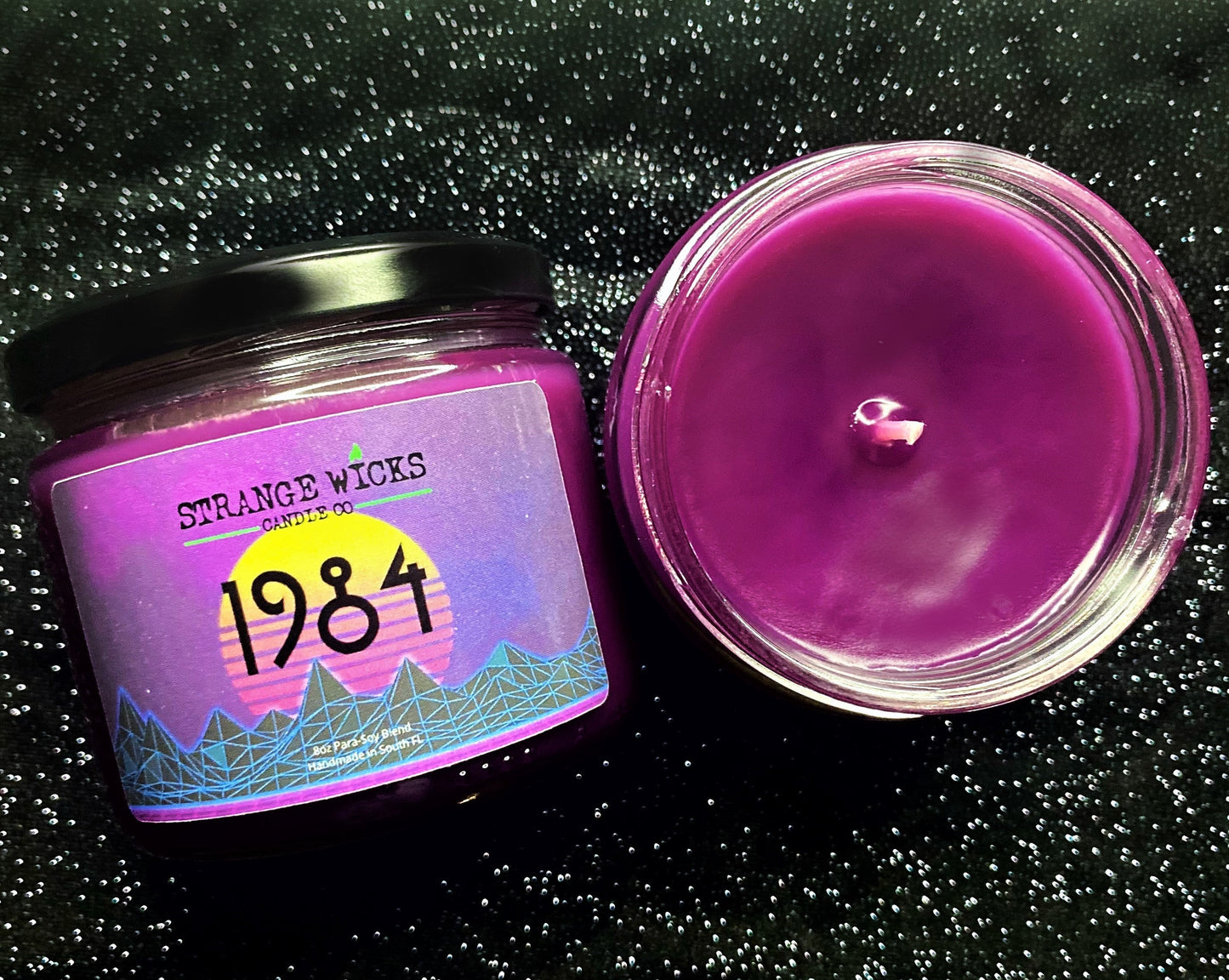 1984 AHS Candle – purple jar with retro 1984 sunset label beside open jar
