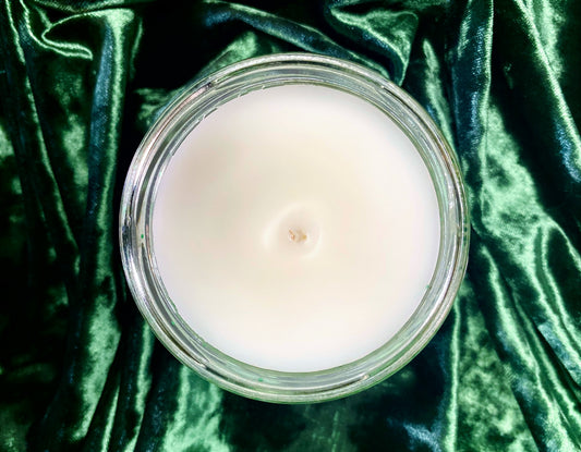 Top-down view of Malfoy Candle showing white wax surface and centered wick