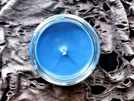 Top-down view of Donnie Darko candle's smooth blue wax surface
