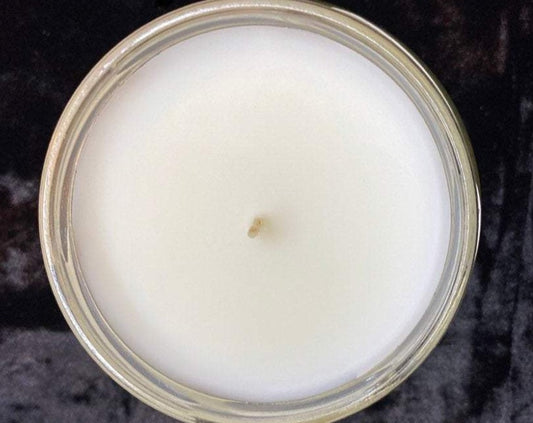 Top-down view of unlit Sorting Candle showing smooth white wax and wick