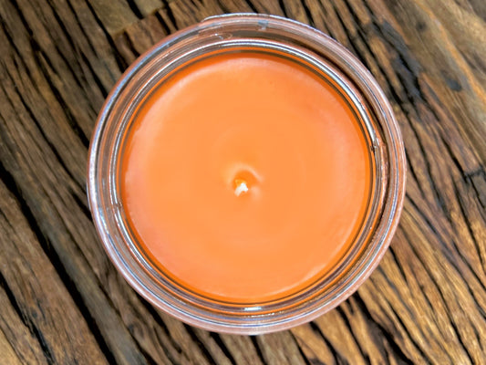 Top-down view of the open This is My Reading Candle's orange wax