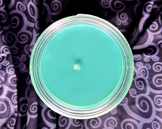 Top-down view of Sally candle with teal wax
