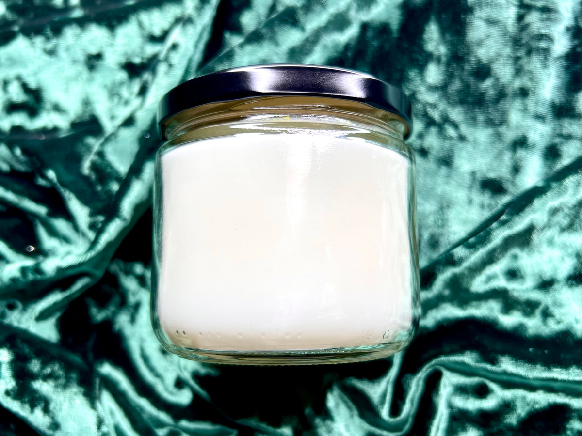 Back view of The Shire candle jar showing plain white wax