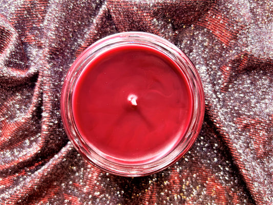Top-down view of Shiver With Anticipation candle's red wax surface