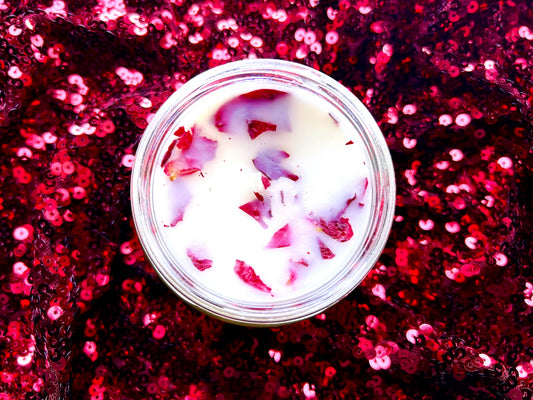 Top-down view of Probably Reading Smut candle's rose petal wax embeds