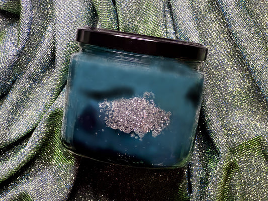 Velaris – ACOTAR Candle – back view of teal glitter wax jar with black lid