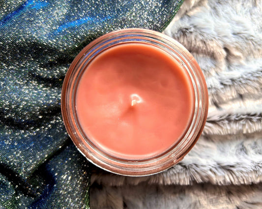 Top-down view of the open What Would Dolly Do? candle's pink wax