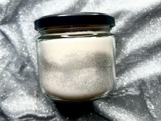 The Skin of a Killer candle showing white wax swirled with silver glitter