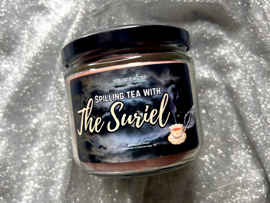 Close-up of Spilling Tea With the Suriel candle label with teapot art