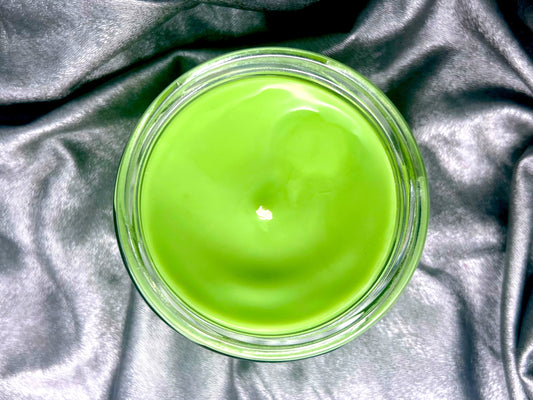 Top view of Punk's Not Dead candle, bright green wax with swirls