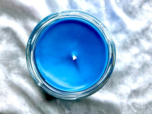 Top view of Patronus candle, smooth bright-blue wax with centered wick