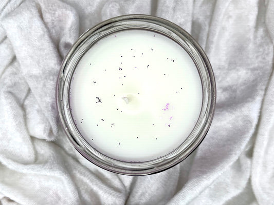 Top-down view of Speak Now candle's white wax with glitter flecks