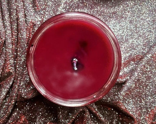Top-down view of open Cassian candle with red wax