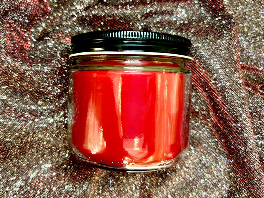 Back view of Mentally Dating Pedro Pascal candle, red wax, no label visible