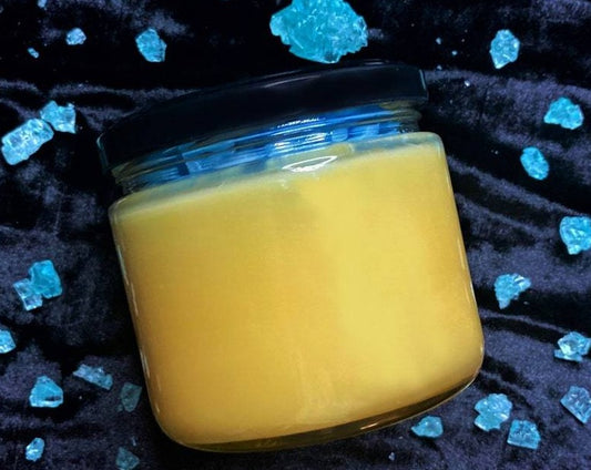 Unlabeled yellow Heisenberg candle jar surrounded by blue crystals
