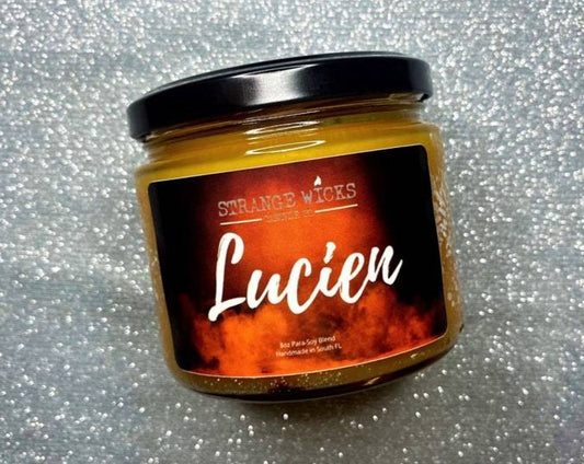Close-up of Lucien candle label with flame background