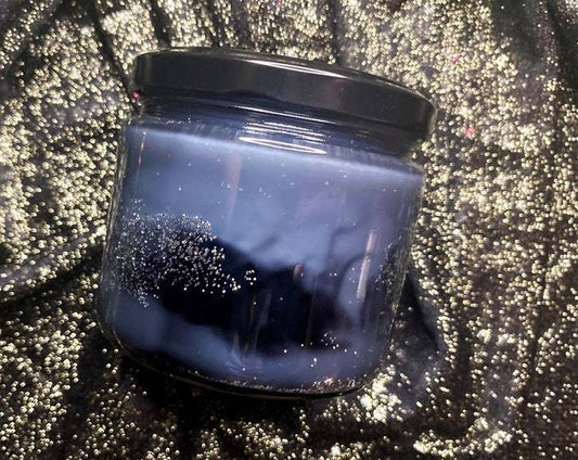 Unlabeled Night Court candle jar showing dark blue-gray wax and glitter