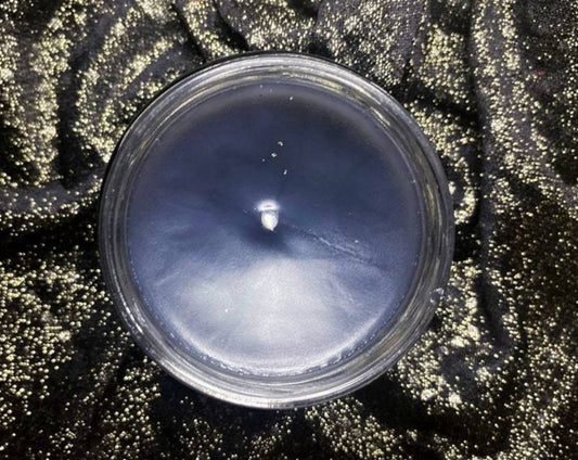 Top-down view of the open Night Court candle's dark blue wax