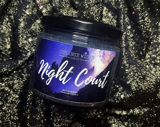 Night Court candle with black lid and starry-night label on glitter fabric
