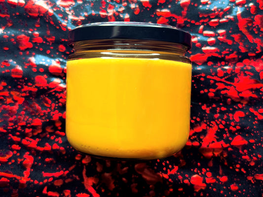 Back of Check Your Candy candle showing orange wax and black lid