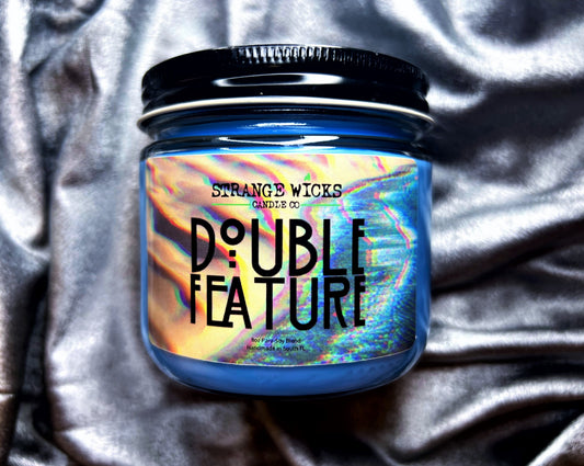 Double Feature - AHS Candle – blue jar candle with rainbow glitch art label
