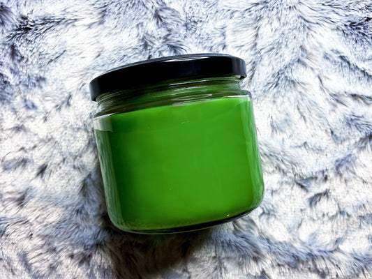 Back view of Team Edward candle jar showing bright green wax through glass