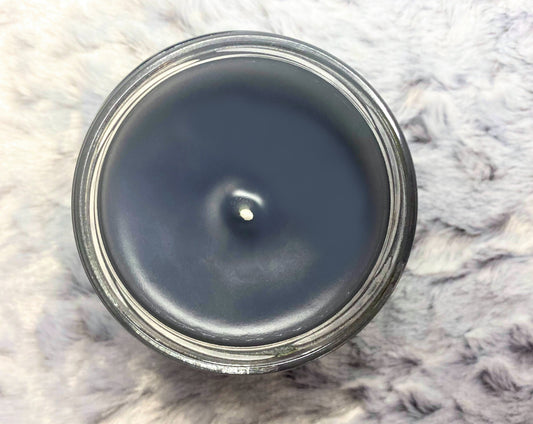 Top-down view of open Jon Snow candle showing black wax
