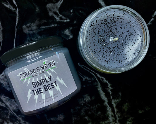 Simply the Best candle top-down: glittered wax and wick, lid beside jar