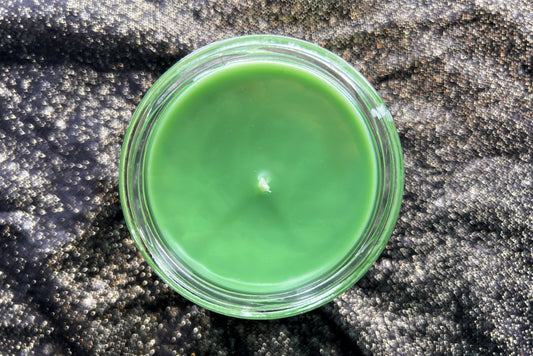 Top-down view of the Twin Peaks candle, unlit wick in green wax