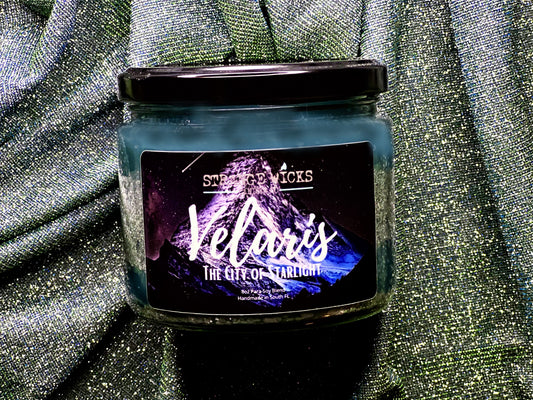 Close-up of Velaris – ACOTAR Candle label: The City of Starlight over a purple mountain
